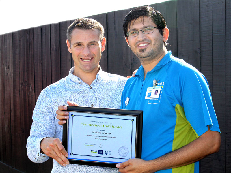 Mukesh Kumar receives his Certificate of Long Service from Jan Lichtwark, CrestClean’s Tauranga Regional Manager.