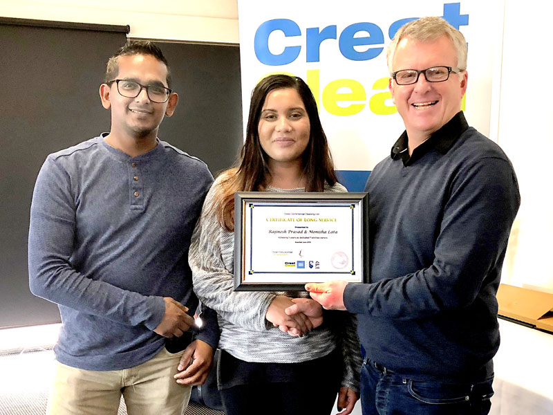 Rajinesh Prasad and Monisha Lata, who have been business owners for three years, receive their Certificate of Long Service from Grant McLauchlan, Crest’s Managing Director.