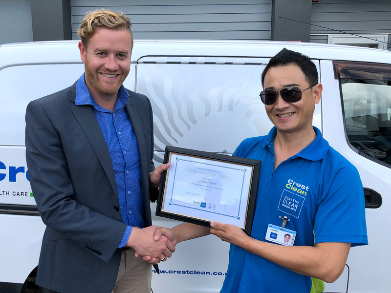 Daniel Park receives his long service award from Damon Johnson, CrestClean’s Assistant Franchise Manager.  