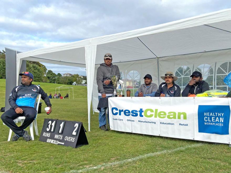 Keeping score at a cricket match.