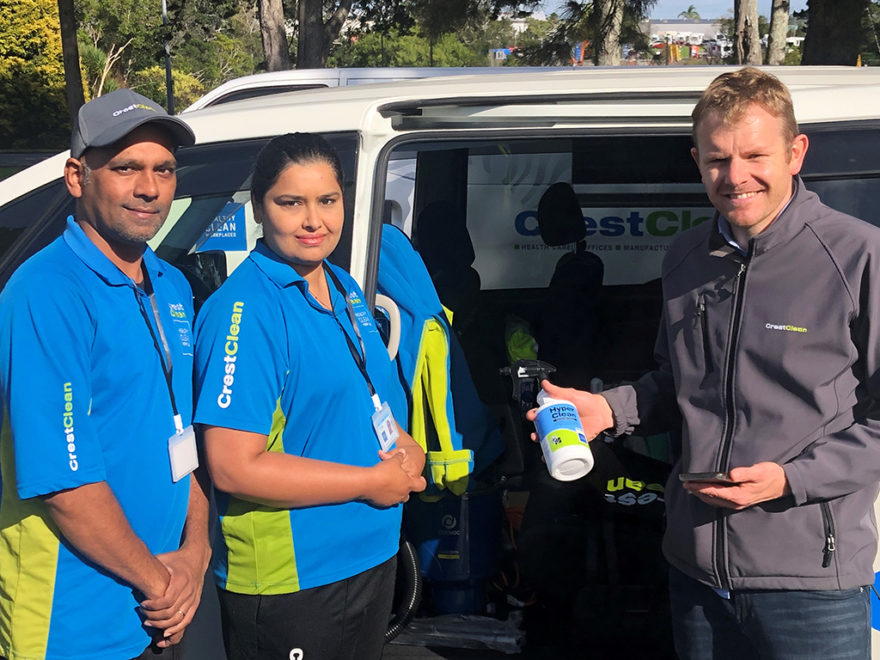 Cleaning franchisees standing by their van.