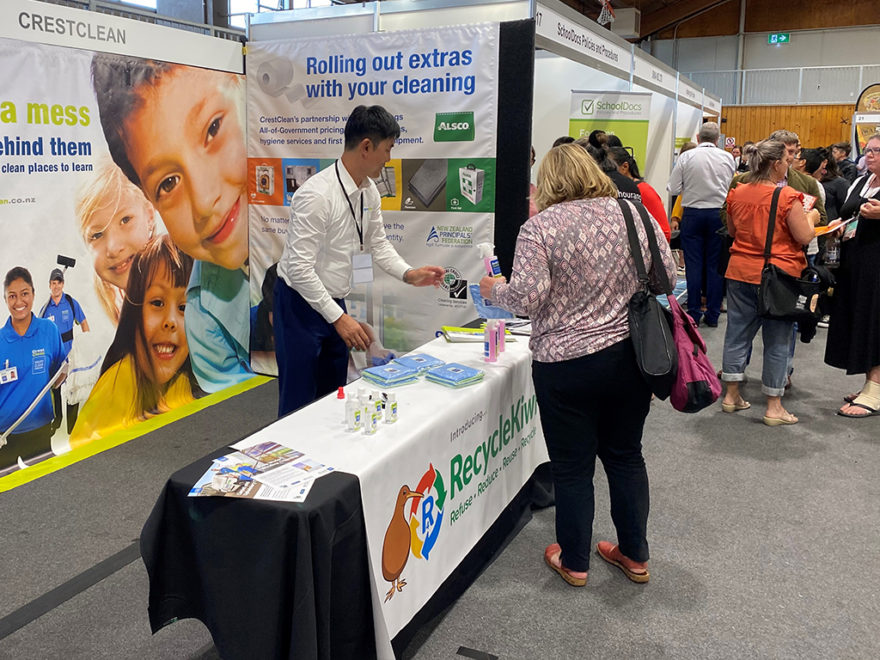 Cleaning trade stand at conference.