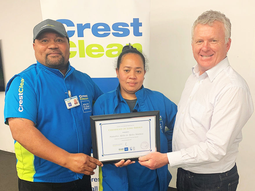 Cleaners are presented with award.