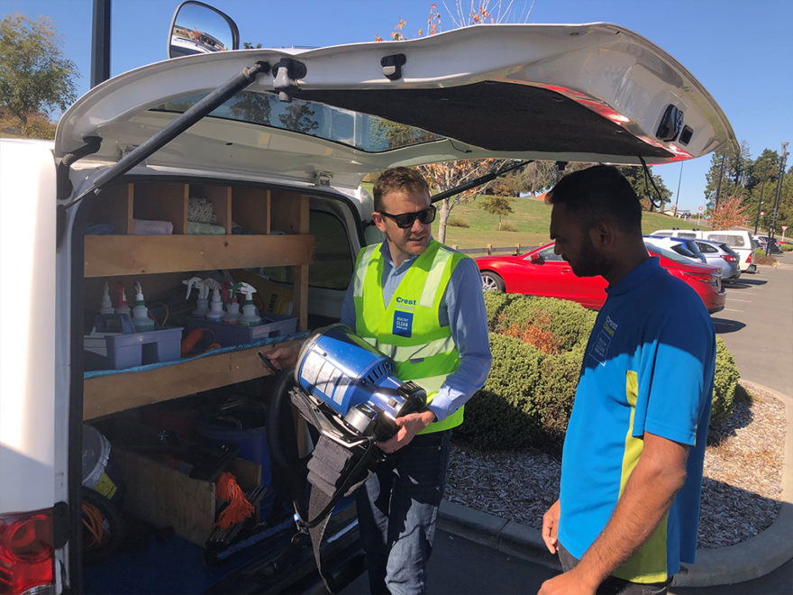 Manager inspects cleaning eqipment.