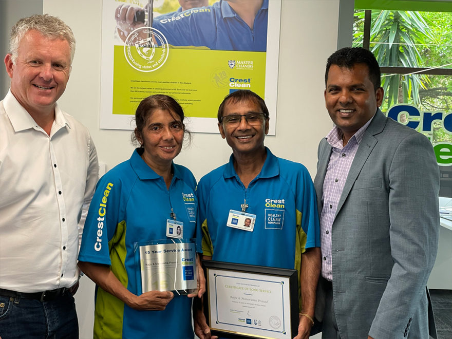 Cleaners are presented with certificate.