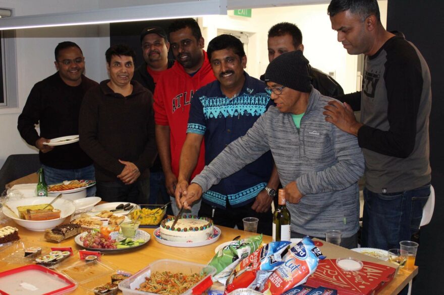 Man cuts cake.