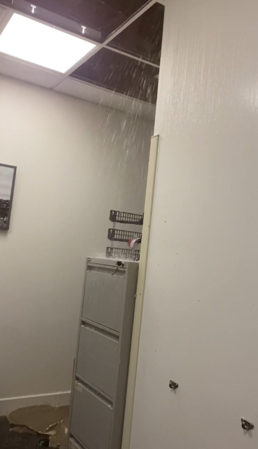 Water pouring from the ceiling.