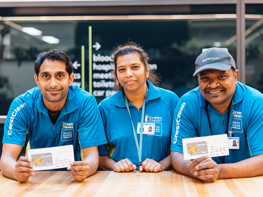 Cleaners holding gift vouchers.