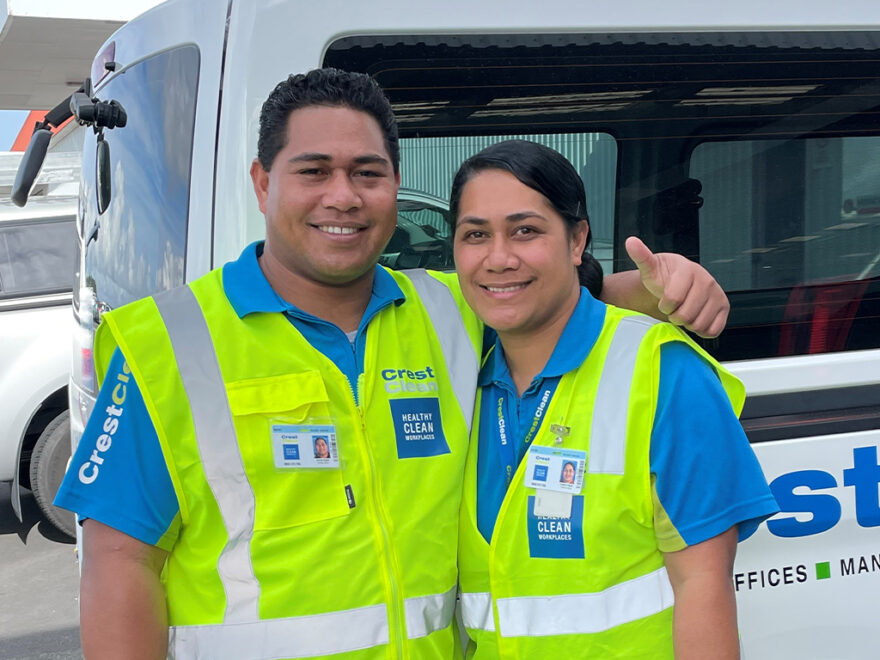 Husband and wife cleaning team standing together.