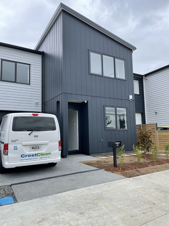 House exterior with cleaning van parked outside.