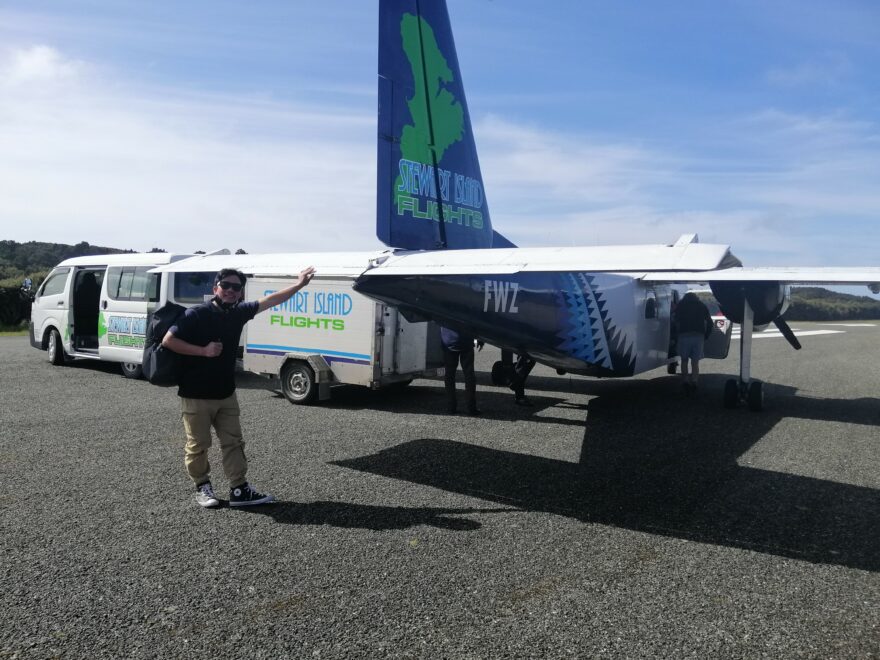 Man standing by aeroplane.