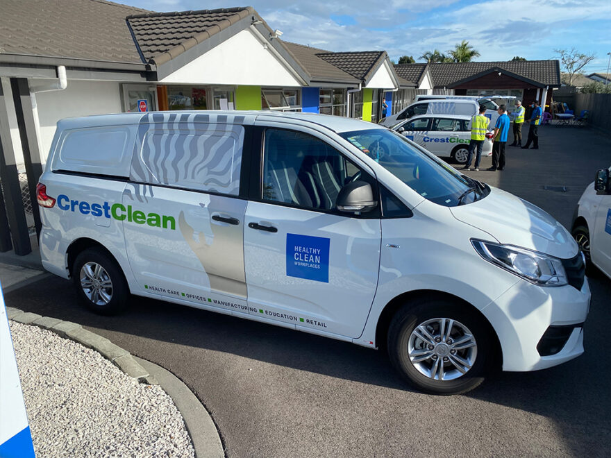 Cleaning vans being inspected.